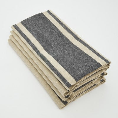 Stack of tan napkins that feature a wide gray stripe in the middle and two thin gray stripes on either side.