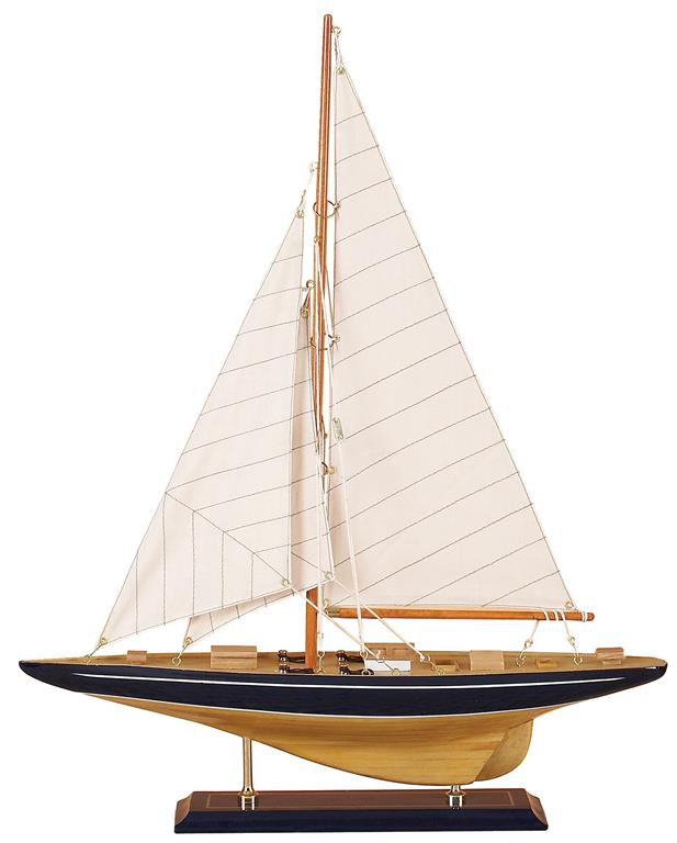 An image of the side of a wooden model sailboat.  The base is dark brown and has two vertical bras supports holding the hull of the boat.  The boat itself has a wide navy stripe running the length of the boat, and a thin white one just below the railing.  The sails are off white and have a thin pin stripe diagonal navy blue pattern. 