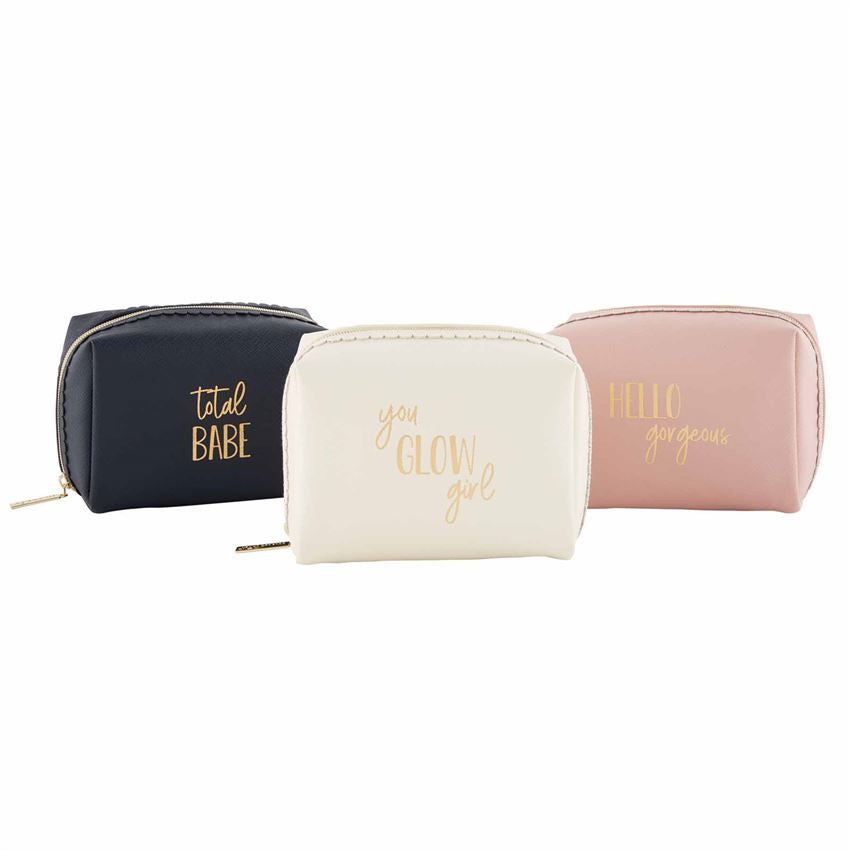 A photo of three square make up bags, each with a saying in gold on them.  From the left, the navy one says 'total babe,' the cream one in the middle says 'you glow girl,' and the one on the right is a blush color and says 'hello gorgeous'