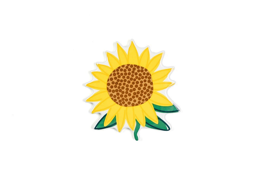 A flat ceramic yellow sunflower with small green stem and green leaves along the bottom.