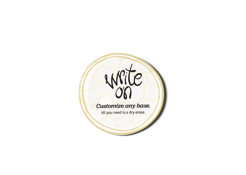A circular ceramic flat item that has a double border of tan and a faint white polka dot patterned background.  The text on it says 'Write on, customize any base, all you need is dry erase'
