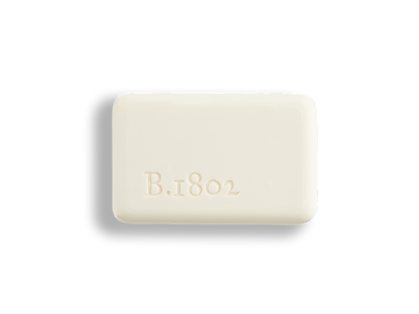 A 9 oz. bar of Honey & Orange Blossom Goat Milk Soap out of packaging