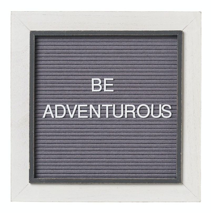 Light gray framed sign, with inner dark gray trim.  Middle of sign is a square of felt that adjustable letters can be arranged on.  Sample text says 'Be Adventurous'