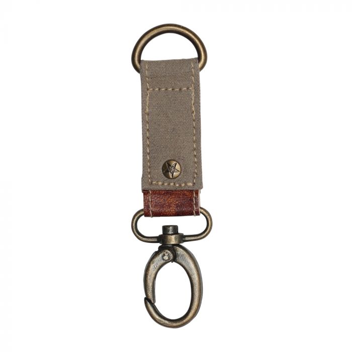 Canvas key fob with brass details, leather accent, and a rivet with a star embossed.  The canvas color is brown.