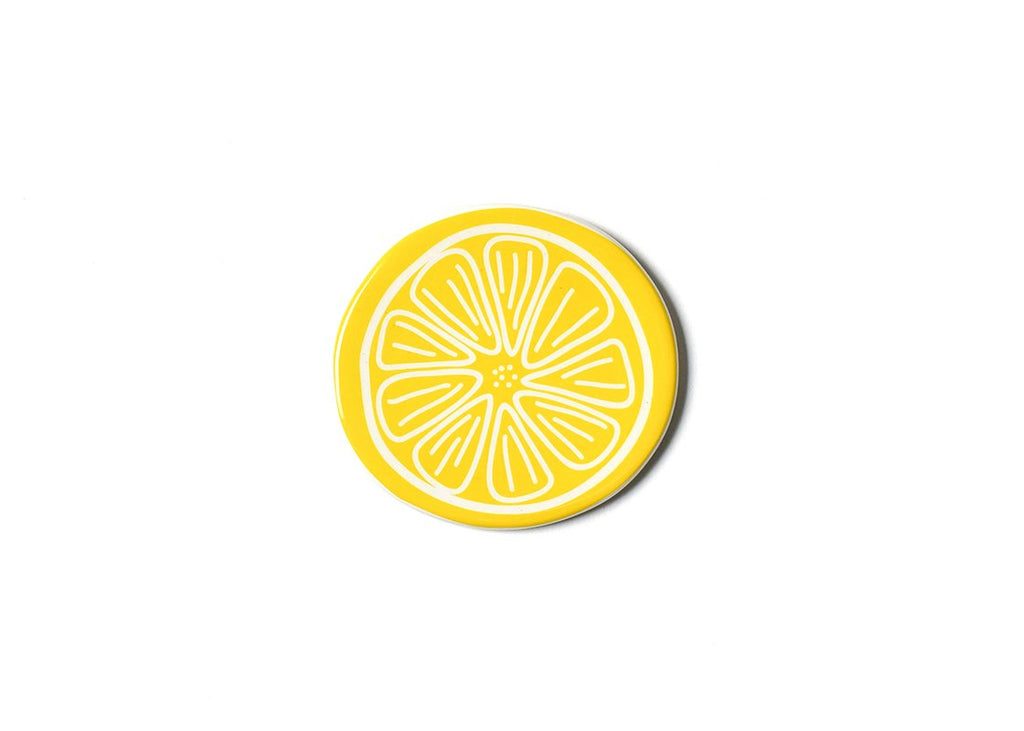A flat ceramic round circle painted yellow with white line work in the middle to look like a lemon slice.