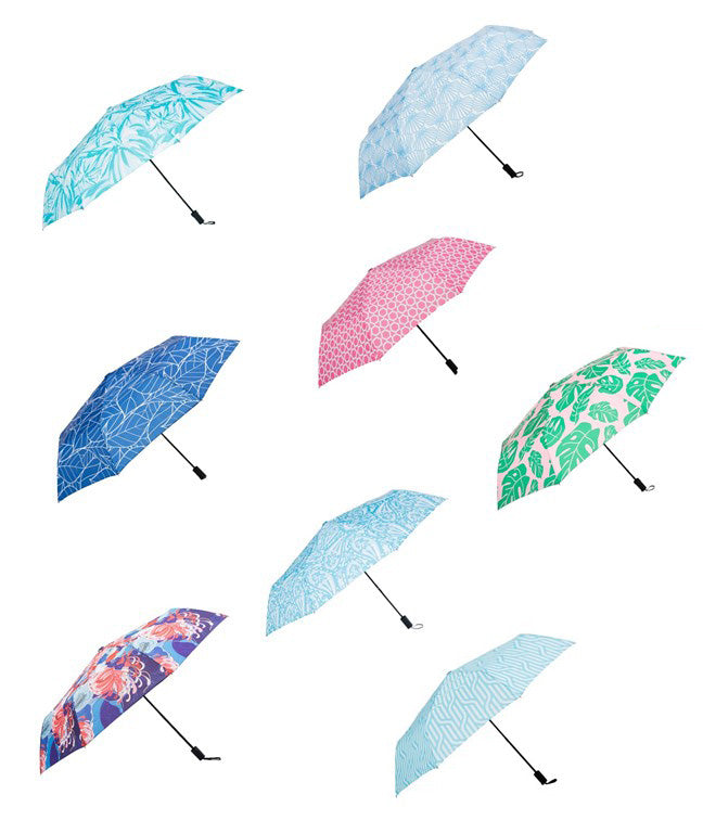 8 umbrellas with assorted spring patterns open on a white background.