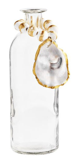 Clear glass vase with beaded string and Oyster detail.  Bead finish is white with brushed metallic gold.  Oyster shell features a painted gold outline.