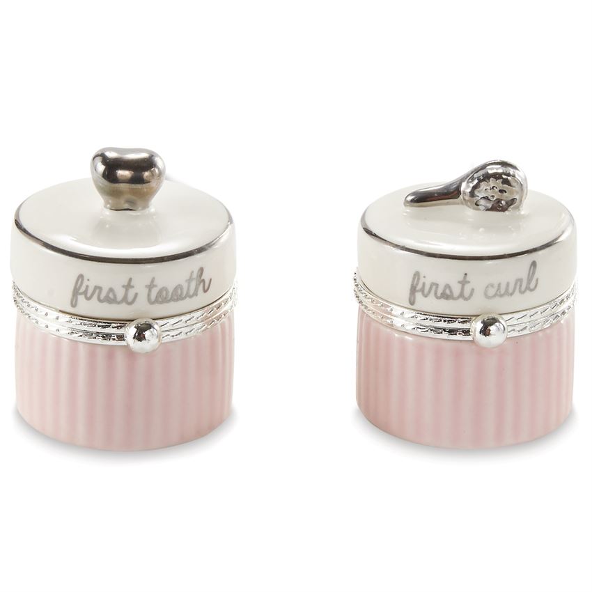 2-piece set. Ceramic tooth and curl keepsake boxes feature silverplate tooth and brush toppers.  The lid is off white with a silver ring around the top, script on the side of the top says 'first tooth' and 'first curl'.  The bottom is alternating vertical pink lines.
