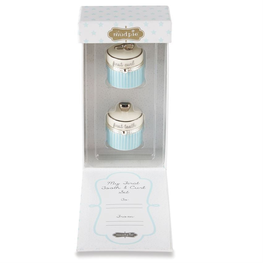 Ceramic first curl and tooth containers in gift box.  Box opens from the front, and each container is in a clear plastic tray.  The inside of the box lid has a place to personalize to and from.