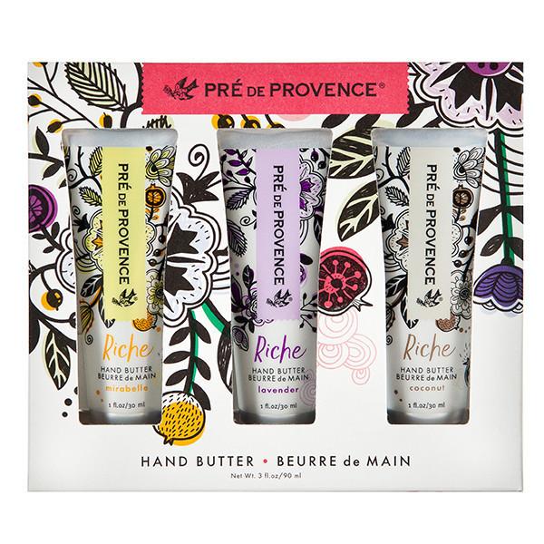 Set of three tubes hand butter lotion in a box with floral illustrations.  Box is windowed to show each tube of cream.  Scents included are Mirabelle, Lavender, and Coconut.