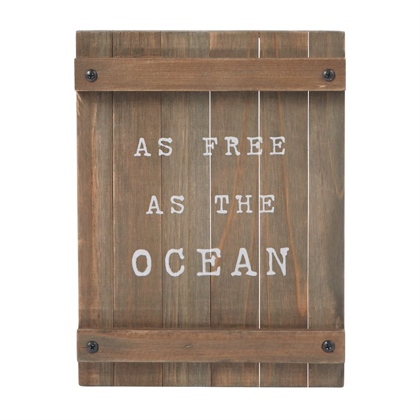 Wooden plank sign with white printed text "as free as the ocean