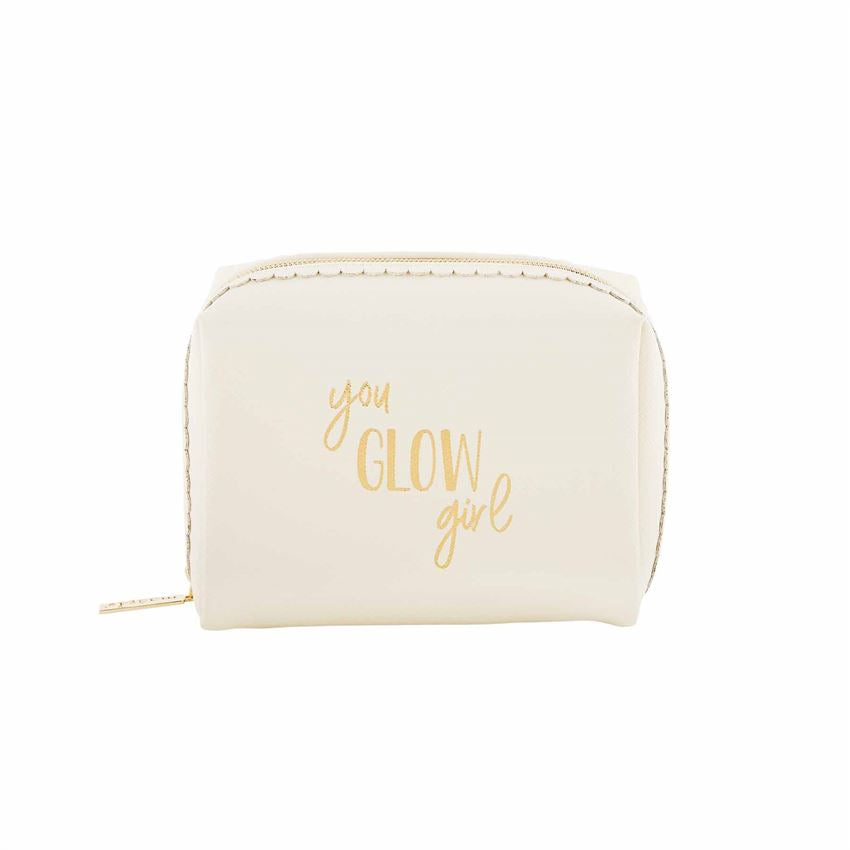 A photo of a square make up bag cream in color and says 'you glow girl' in gold.