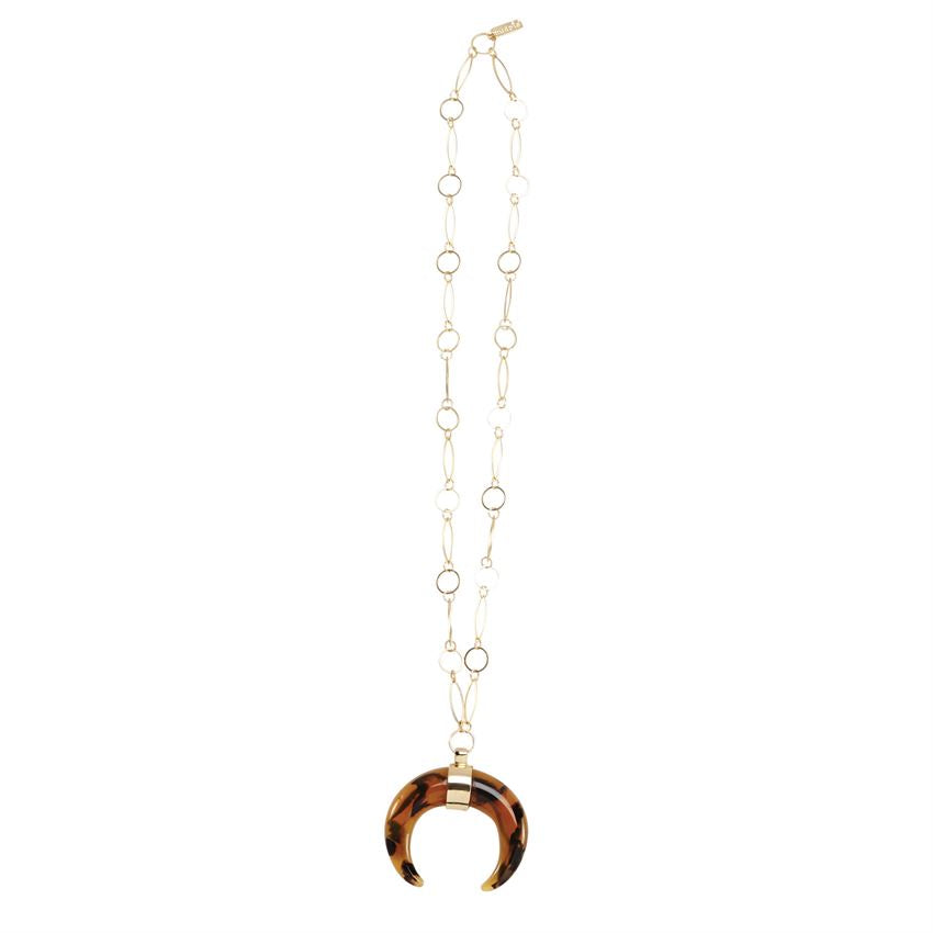 Black and brown crescent shaped pendant on a long gold chain