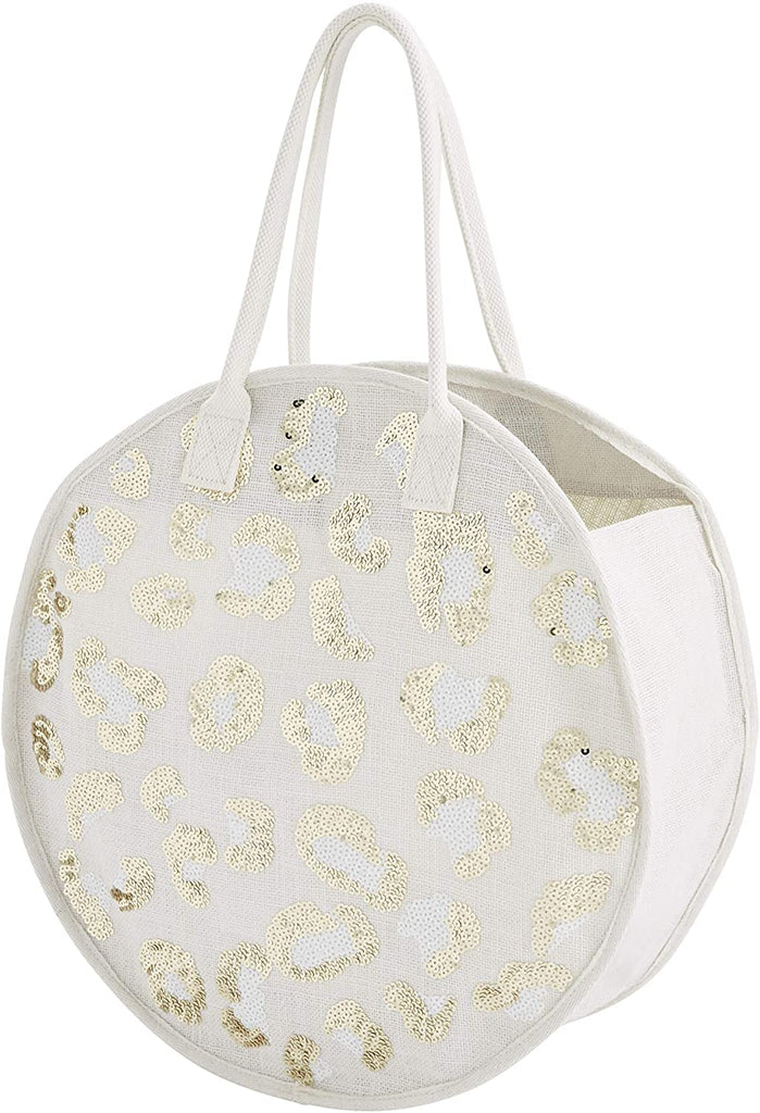 A round jute bag with white handles on a white background.  The front of the bag feature a leopard pattern in gold and white sequins