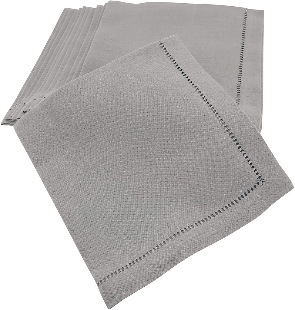 A stack of 12 20" x 20" gray napkins folded into squares stacked on top of each other.  The napkins have a 'hemstitched' detail inset an inch from the edge.