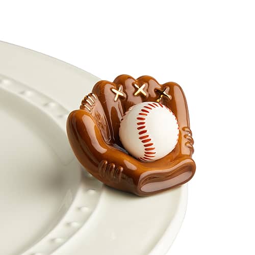 A ceramic baseball glove holding a baseball attached to the edge of a tray.