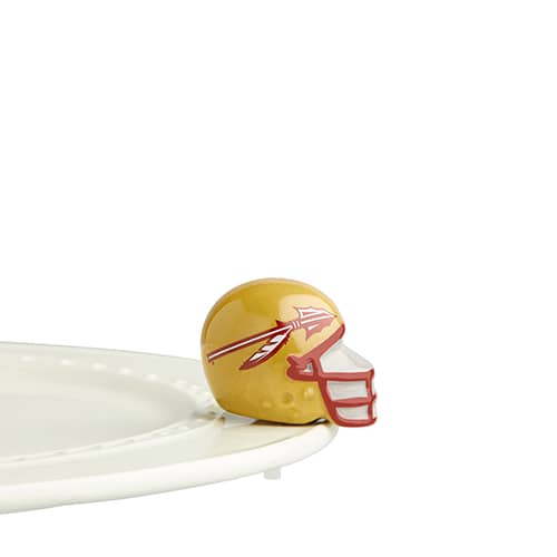 A gold and burgundy football helmet with a spear graphic, attached to the edge of a tray.