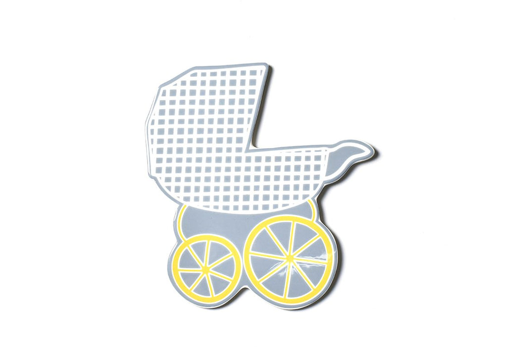 A flat ceramic cut out of a baby carriage.  The background of the piece is gray, with the carriage being a lattice white pattern.  The wheels are yellow.