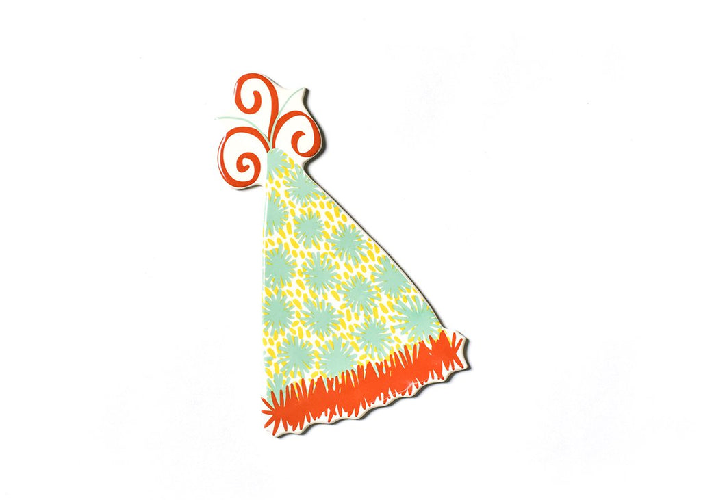 A flat ceramic cut out of a party hat.  The brim of the hat is red and is drawn to look like tinsel.  The body of the hat has an aqua and yellow fuzzy polka dot pattern.  The top of the hat has red and teal curly cues coming out of it.