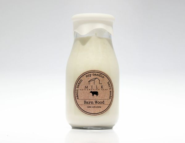 Milk bottle soy candle on white back drop