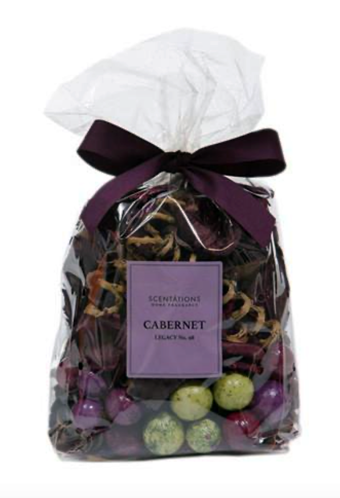 Clear bag of potpourri with purple ribbon tied to the top.  Inside the bag are various dried fruits, flowers and natural items.  A purple label on the bag reads "Scentations Home Fragrance Cabernet Legacy No. 98"