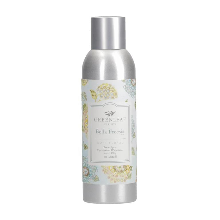 An image of a stainless steel room spray canister with lid on.  The label is white with blue and yellow flowers and a label that says 'Bella Freesia Soft Floral Room Spray'