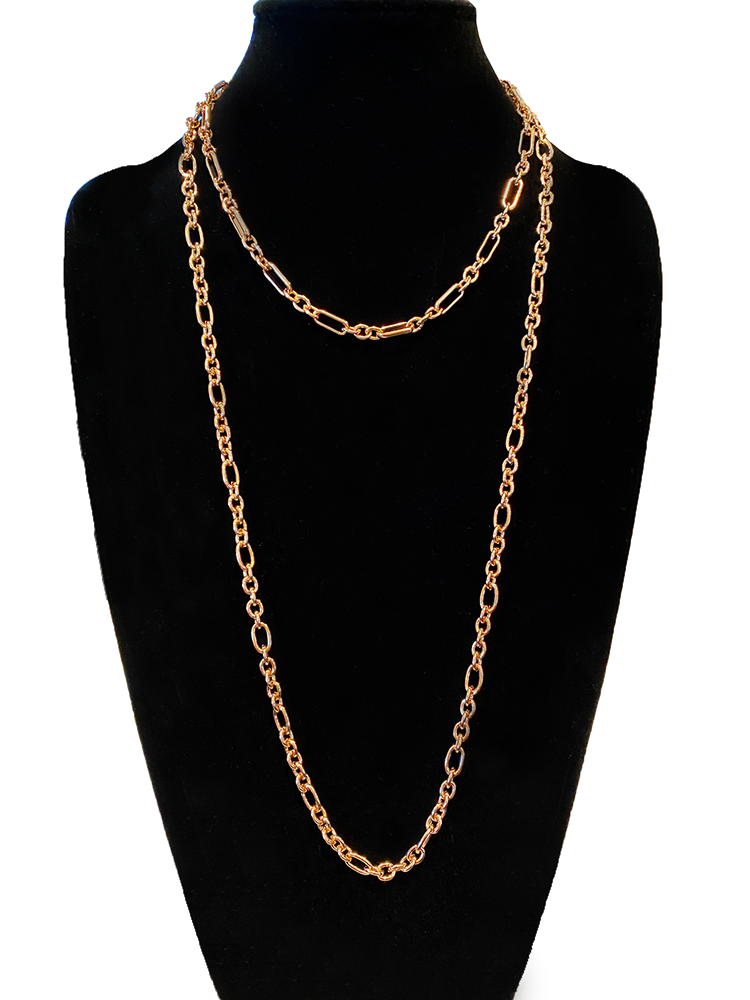 2 gold chains on a black display piece.  One chain is close to the neck, the other is considerably longer.