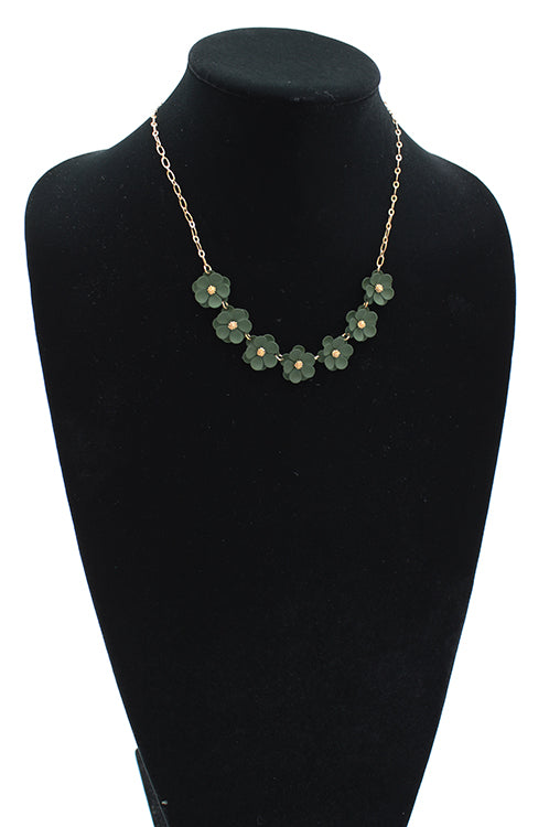 Seven green matte flowers linked together with gold detail on a 6" chain with 3" extender