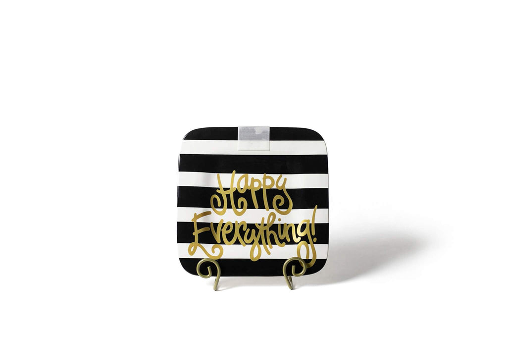 A square platter on a gold plate stand.  The corners of the platter are rounded and the platter has an overall black and white horizontal stripe pattern.  Written across the bottom half of the platter is 'Happy Everything!' in gold.