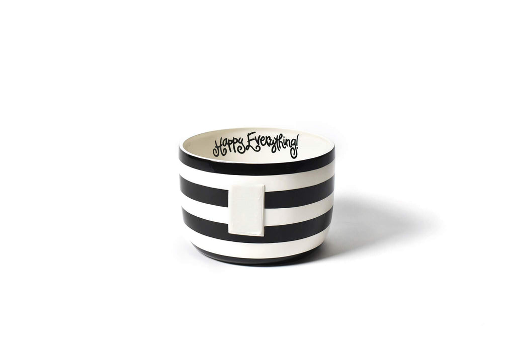 A large bowl on a white background.  The outside of the bowl has alternating black and white wide horizontal stripes.  A large piece of velcro is mounted to the front to receive decorative attachments.  At the top of the inside of the bowl is a fun cursive font that says 'Happy Everything!' in black.  The inside of the bowl is white.