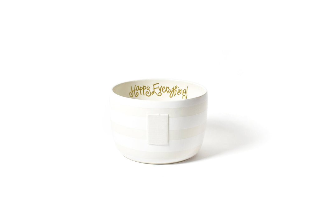 A large bowl on a white background.  The outside of the bowl has alternating white and off white wide horizontal stripes.  A large piece of velcro is mounted to the front to receive decorative attachments.  At the top of the inside of the bowl is a fun cursive font that says 'Happy Everything!' in gold.  The inside of the bowl is white.