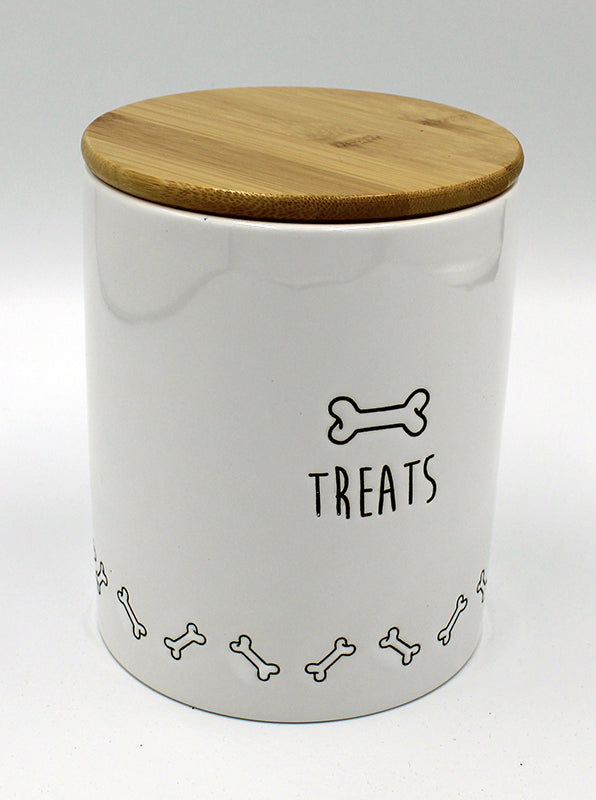 White ceramic canister with glossy wooden lid.  Side of canister has a graphic of a dog bone in black, as well as a border of dog bones around the bottom of the container.  Below the large bone on the side, is the word "Treats."