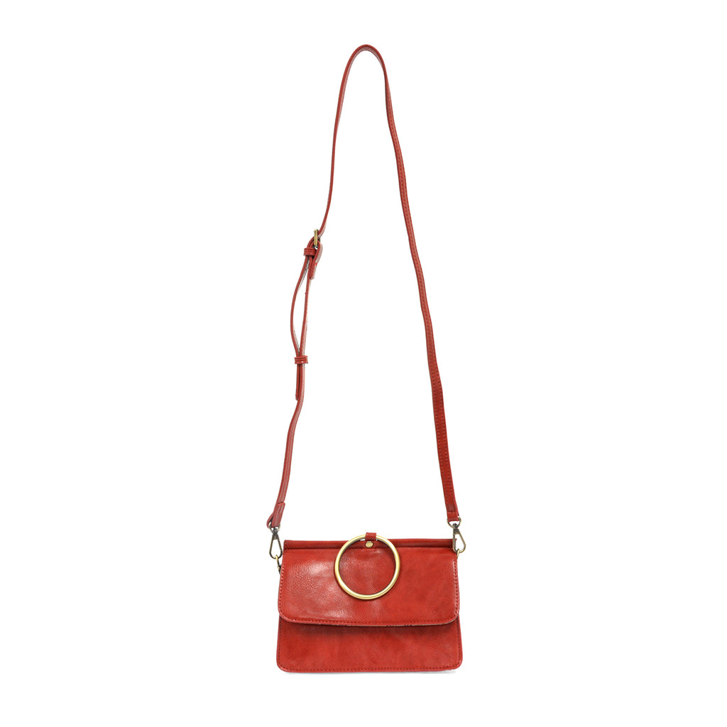 Red leather bag with large metal brass ring with extra long strap.
