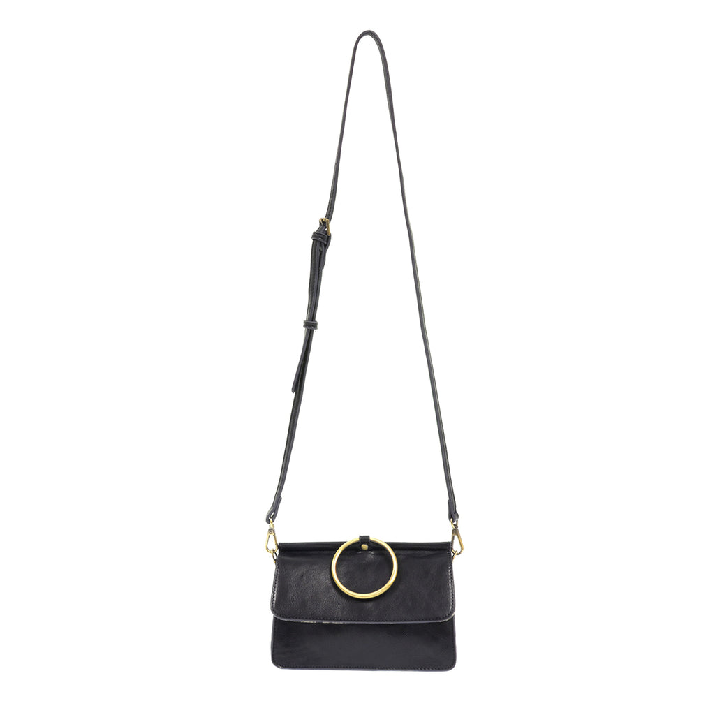 Navy faux leather bag with large metal brass ring with extra long strap.