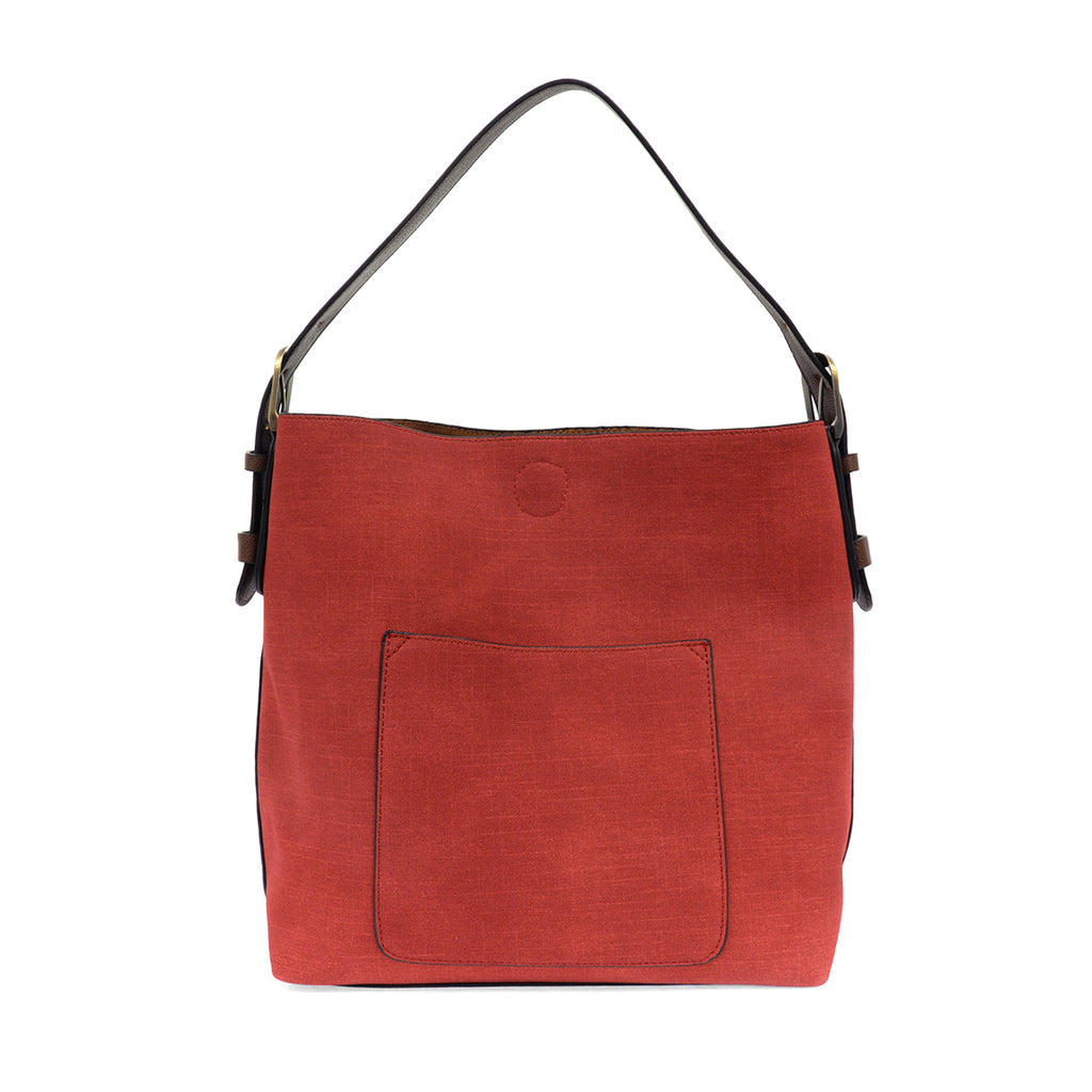 Red faux linen hobo bag with brown buckle strap.