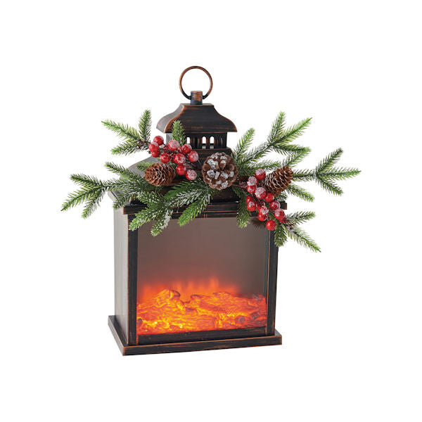 A copper finish lantern with a sprig of evergreen/pinecones/and red berries on the top.
