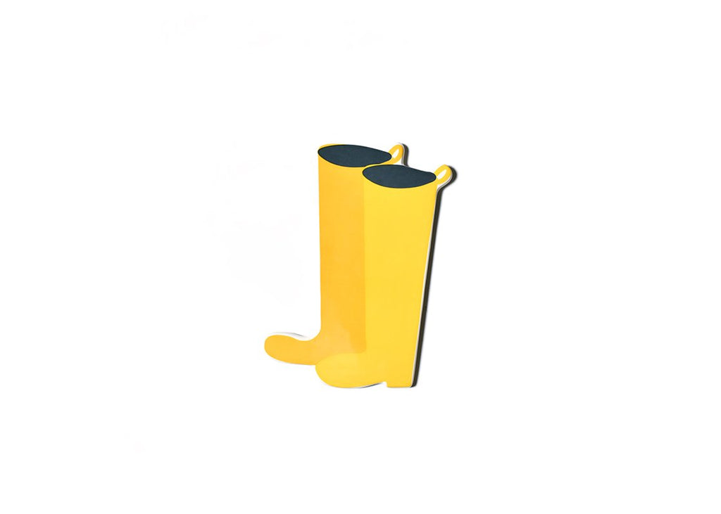 A flat ceramic cut out of a pair of yellow wellington rain boots.