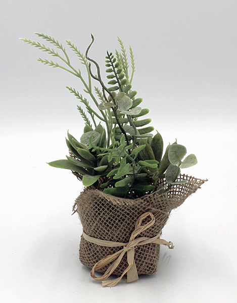 Fern, eucalyptus and succulents are featured in this mixed green bundle wrapped with burlap and finished with a jute ribbon.