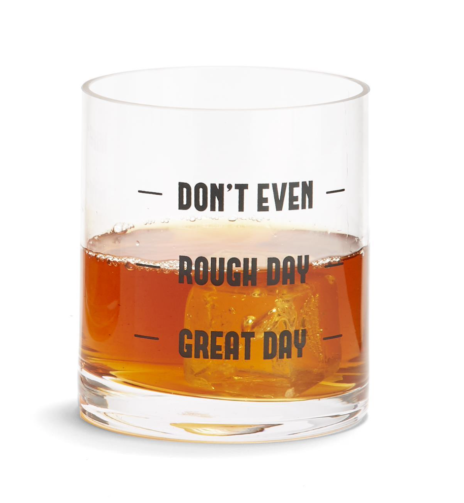 An image of a clear glass tumbler on a white background.  The glass has black printed lettering on the side at three different levels.  The top level says 'Don't Even', middle 'Rough Day', bottom 'Great Day'.  The glass has liquid poured to 'Rough Day'