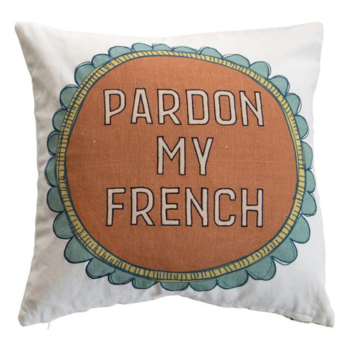 A square pillow with a printed graphic on the front.  The graphic is of an orange circle with gold rim, and teal scalloped edge.  The text on the orange portion reads 'Pardon My French'