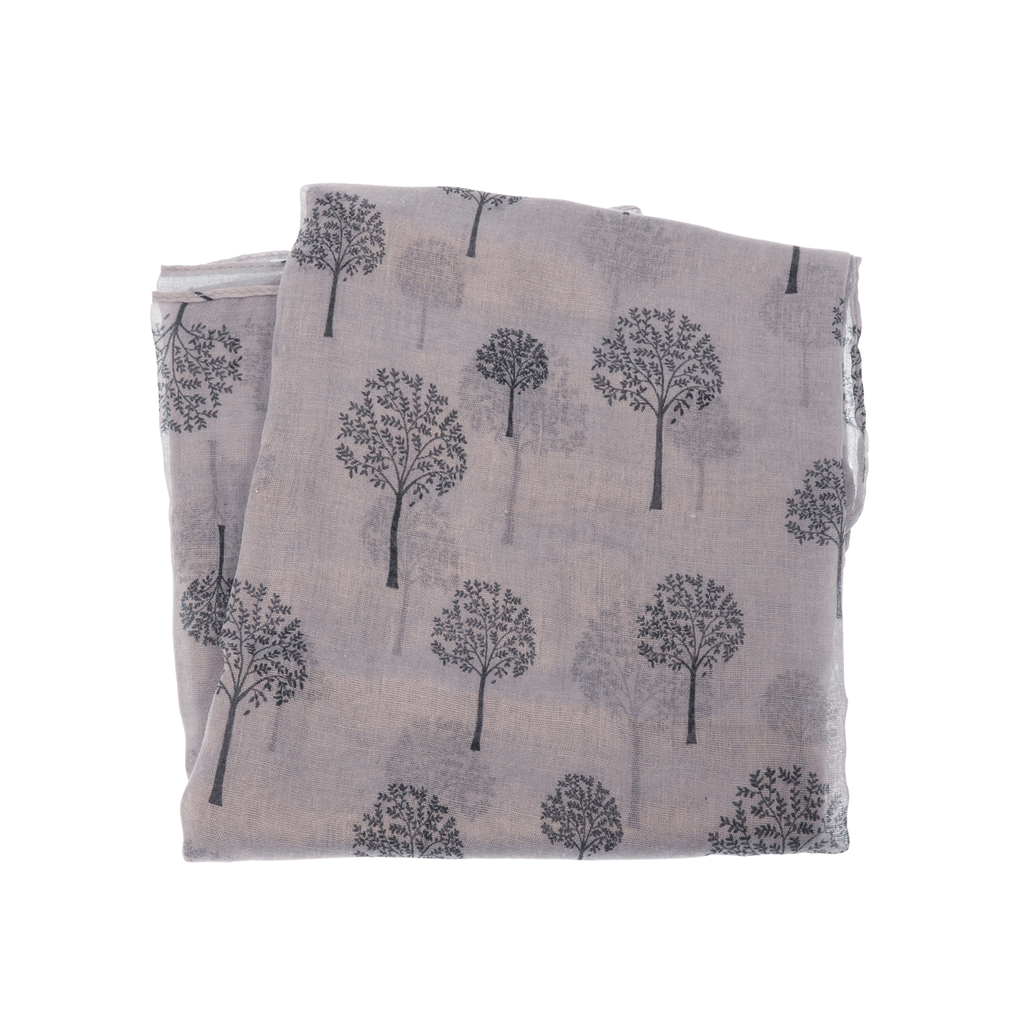 a closeup of a grey scarf with printed trees