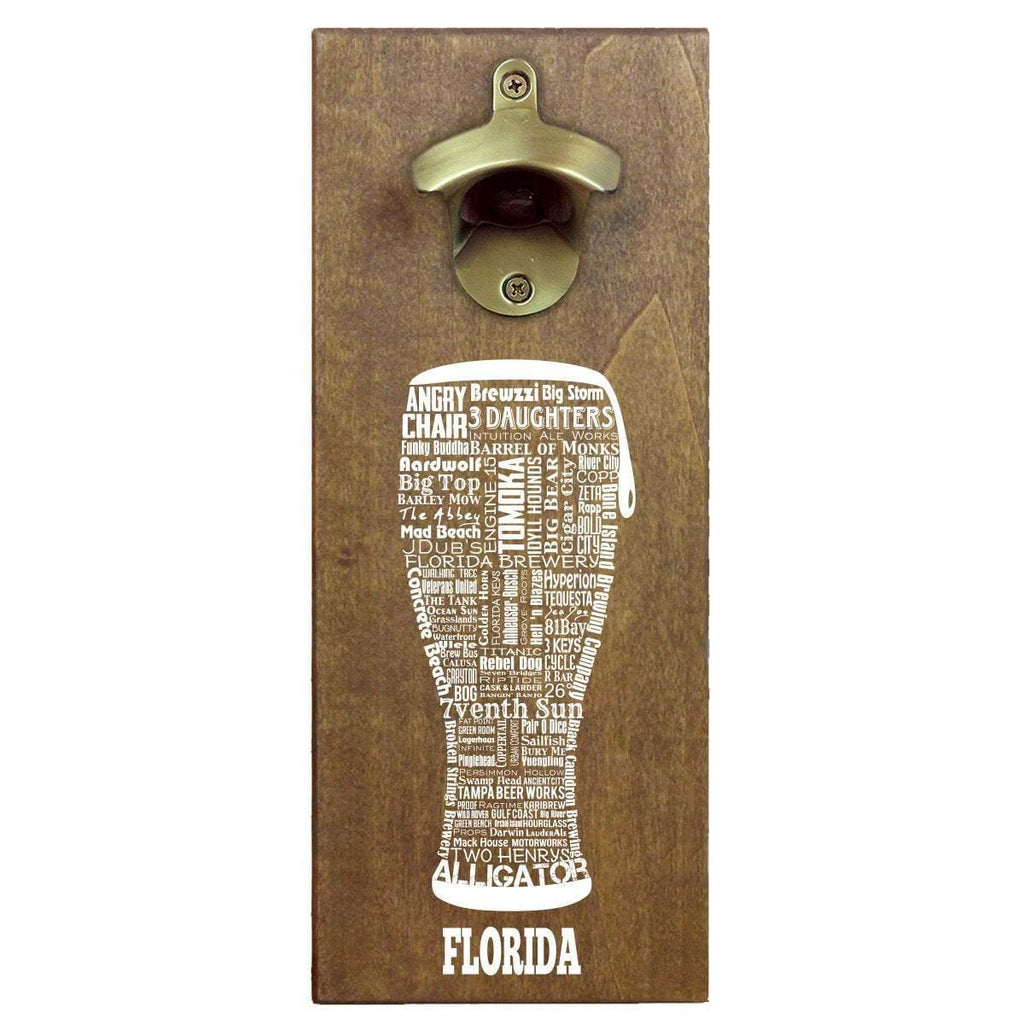 An image of a wall mounted beer bottle opener on a white background.  The brass plated opener is fastened to a wooden board.  Below the opener is an image of a word art pilsner glass made up of various Florida based beer companies.  Below the pilsner is the word 'Florida'