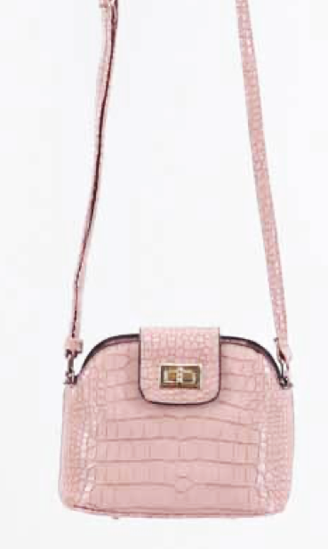 A pink colored purse on a white background.  The purse has an embossed alligator texture and a coordinating strap.  The purse has a brass twist lock enclosure and black trim around the top.