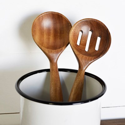 2 wooden spoon set.  Spoons are in a white canister with a black rim, handle down.